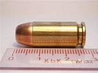 .40 caliber cartridge and ruler